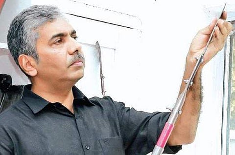 Jacob Thomas, the new MD of Metal Industries, examining agricultural implements on Thursday | Express