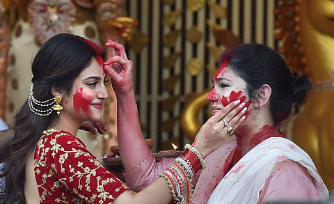 Actor and TMC MP Nusrat Jahan during 'Sindoor Khela' at a community puja pandal before Durga idol immersion in Kolkata Friday Oct. 11 2019. | (Photo | PTI)
