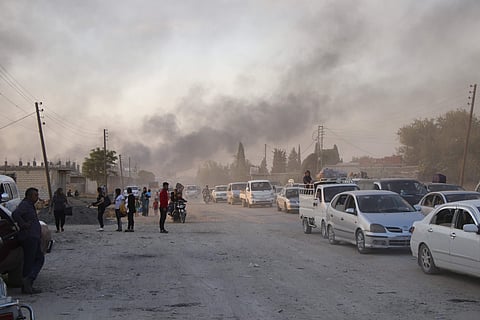 Syrians flee shelling by Turkish forces in Syria. (Photo | AP)