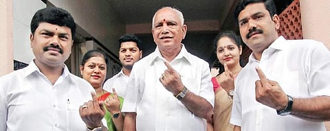 A file picture of Chief Minister B S Yeddyurappa with his sons B Y Raghavendra (left) and  B Y Vijayendra (Photo | EPS)