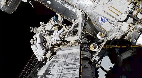 astronauts Christina Koch and Jessica Meir, top right, exit the International Space Station on Friday, Oct. 18, 2019. | ( Photo | AP )
