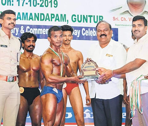 Guntur district Rural SP Ch Vijaya Rao presenting awards to the body-building competition winners on Thursday | Express