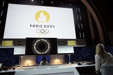 Paris 2024 Olympic logo is displayed on a screen during a ceremony, in Paris. (Photo | AP)