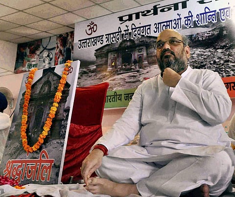 Then Uttar Pradesh BJP incharge Amit Shah attends a prayer meeting for Uttarakhand flood victims. (File Photo | PTI)