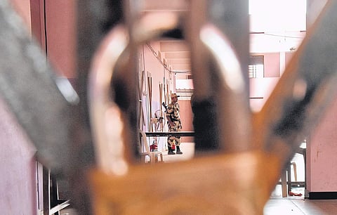 Security personnel guarding the strong rooms in which the electronic voting machines of the Vattiyoorkavu byelection are kept at St Marys HSS, Pattom in Thiruvananthapuram.The counting will take place on Thursday| B P Deepu