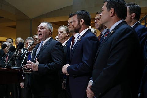 House Minority Whip Steve Scalise, R-La., left, speaks at a news conference in front of House Republicans after Deputy Assistant Secretary of Defense Laura Cooper arrived for a closed door meeting to testify as part of the House impeachment inquiry into P