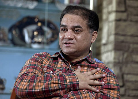 In this Feb. 4, 2013 file photo, scholar of China's Turkic Uighur ethnic minority, Ilham Tohti speaks during an interview at his home in Beijing, China. (Photo | AP)