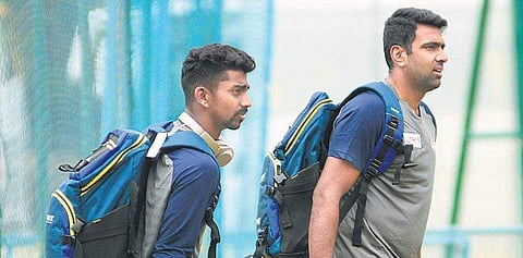 Tamil Nadu’s Baba Aparajith and R Ashwin at Chinnaswamy Stadium on Thursday.