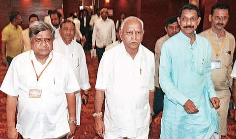 Chief Minister B S Yediyurappa along with BJP leaders at a hotel in Hubballi, on Saturday | D hemanth