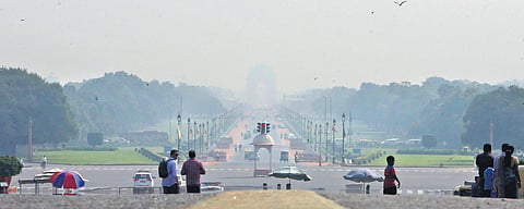 India Gate is seen faintly from Raisina Hills on Saturday morning as a nip in air and dust have started bringing smog in the national capital. (Photo | Shekhar Yadav, EPS)