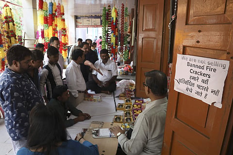 People shop for green firecrackers ahead of Diwali in New Delhi on October 25, 2019. (Photo | AP)