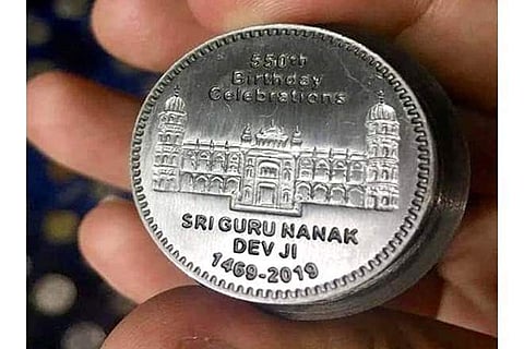 “Pakistan issues commemorative coin to mark the 550th anniversary of Guru Nanak Devji,” Khan said in the post. (Photo source: Facebook/@ImranKhanOfficial)