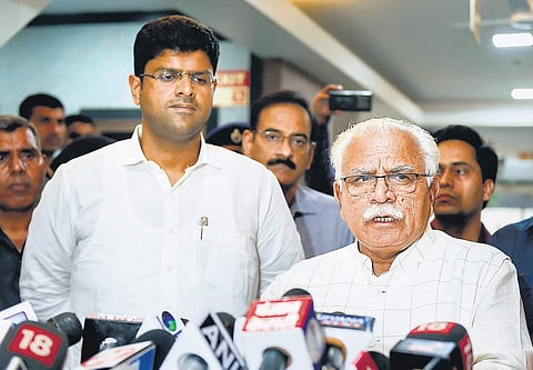 Former Haryana Chief Minister Manohar Lal Khattar and former Deputy Chief Minister Dushyant Chautala in happier times 