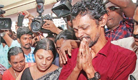 File photo of Apheel Johnson’s parents George and Darly are inconsolable in front of the mortal remains of their only son | Express
