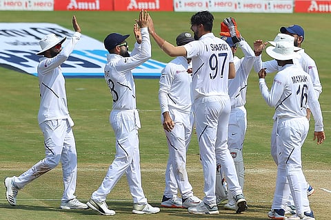 Fast bowler Ishant Sharma celebrates a wicket with teammates. (Photo | AP)