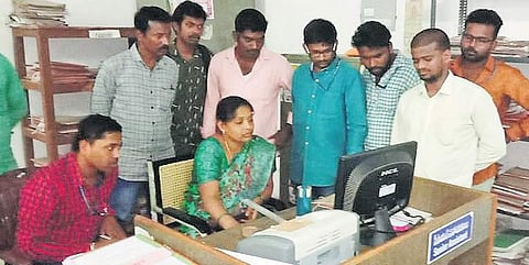 Council for Civil Rights (CCR) representatives inspect data of pending ration card applications at District Civil Supplies Office in Karimnagar on Wednesday