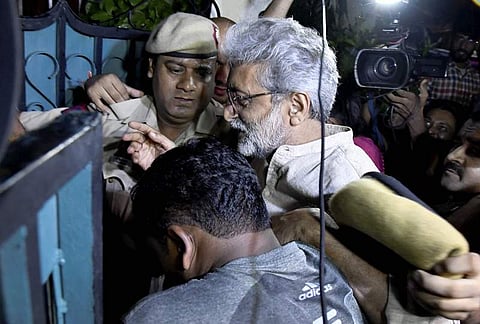 Human rights activist Gautam Navlakha being arrested by the Pune police at his residence (File Photo | PTI)