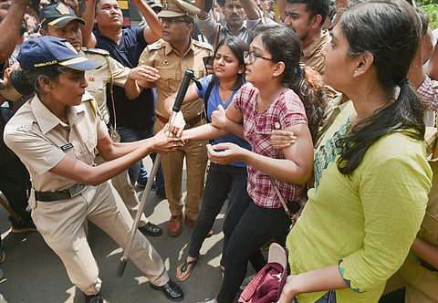 Police detain activists who were staging a protest against the tree-cutting being carried out for the Metro car shed project at Aarey colony in Mumbai Saturday Oct. 5 2019. (Photo | PTI)