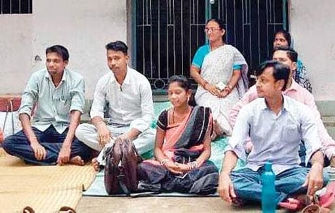 Supporters of MLA Sukanta Kumar Nayak staging a sit-in outside Tehsildar’s office after locking it with the officials inside I Express