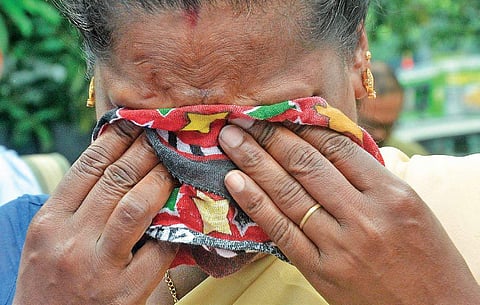 The mother of the minor girls, who died under mysterious circumstances at Walayar, breaking down as she emerges from the meeting with Chief Minister Pinarayi Vijayan at the Kerala Assembly in T’Puram, on Thursday | Express