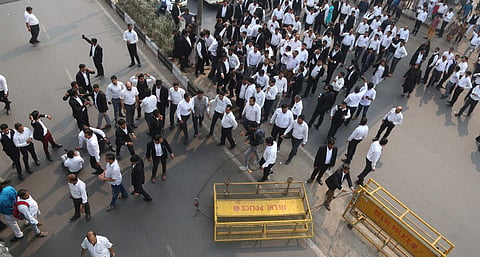 Lawyers shout slogans against Delhi Police during a protest as they block a road outiside Tis Hazari Court in New Delhi. | (File | EPS)