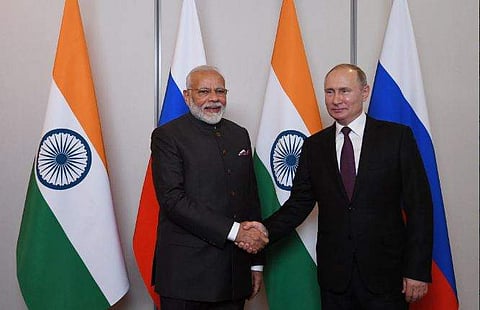 Russian President Vladimir Putin meets Indian Prime Minister Narendra Modi in Brazil. (Photo | Twitter)