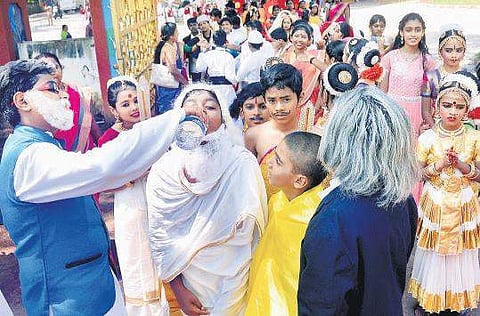 Children dressed as Amitabh Bachan, A P J Abdul Kalam quench their thirst after participating in the rally held as part of Children’s Day celebrations in the city| Vincent Pulickal