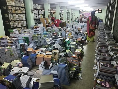 Books strewn across the floor of the District Central Library in Madurai.