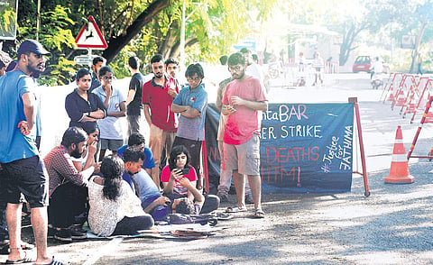 Azhar and Justin, students from Humanities and Social Science department of IIT-Madras, sit on hunger strike demanding an internal probe into the death of Fathima Latheef, on the campus in Chennai on Monday  | DEBADATTA MALLLICK