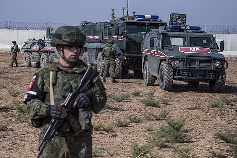 Turkish and Russian patrol is seen near the town of Darbasiyah, Syria, Friday, Nov. 1, 2019. Turkey and Russia launched joint patrols Friday in northeastern Syria, under a deal that halted a Turkish offensive against Syrian Kurdish fighters who were force
