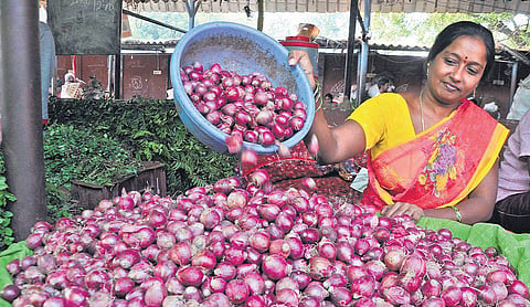 A vendor selling onions at the Patamata rythu bazar in Vijayawada on Friday| Prasant Madugula