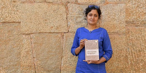 Meera Iyer with her book 'Discovering Bengaluru'. (Photo | Meghana Sastry, EPS)