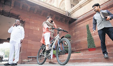 BJP MP and the party’s Delhi supremo Manoj Tiwari arrives in Parliament on a bicycle on Monday.  | Shekhar Yadav