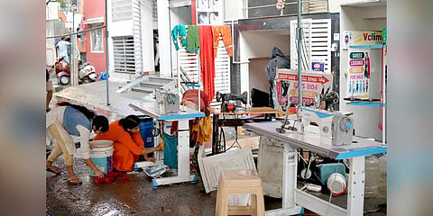 Lavanya cleans up her sewing machine. (Photo | Express)