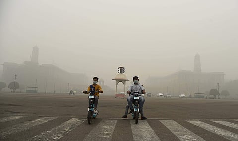 Children wear mask to protect themselves from pollution as a the air quality dips to ‘severe’ category, in New Delhi. (Photo | Parveen Negi, EPS)