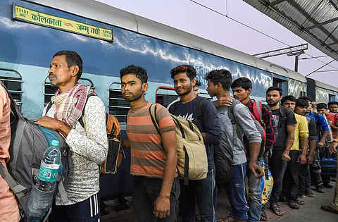 Workers arrive at the station from Jammu and Kashmir in Kolkata Monday Nov. 4 2019. | (Photo | PTI)