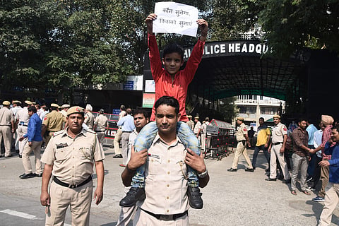 Police officials protest the assault on policemen following clashes with lawyers at Tis Hazari court last week in New Delhi. (Photo | Parveen Negi, EPS)