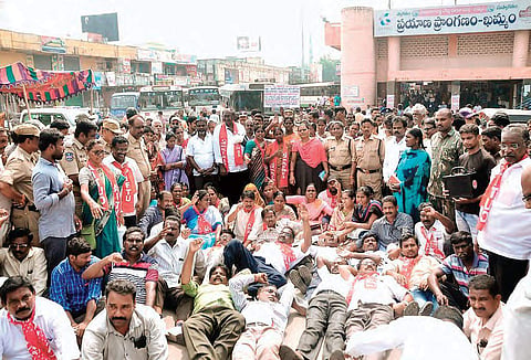 The RTC employees and Left parties’ workers stage a protest in front of Khammam bus depot on Wednesday