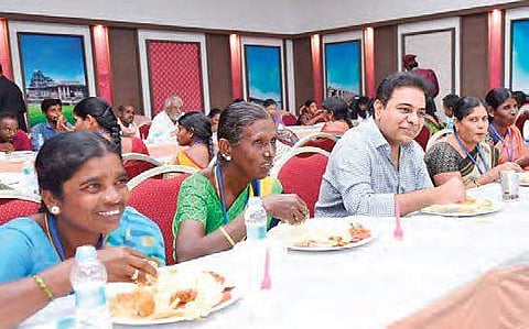 TRS working president KT Rama Rao having lunch with women party workers after giving them insurance cheques at Pragathi Bhavan in Hyderabad on Wednesday