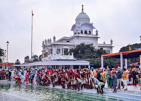 Sikh devotees pay tributes ahead of the celebrations of the 550th birth anniversary of Sikh Guru Nanak Dev ji at the Gurdwara in Sultanpur Lodhi Nov. 8 2019. | (Photo | PTI)
