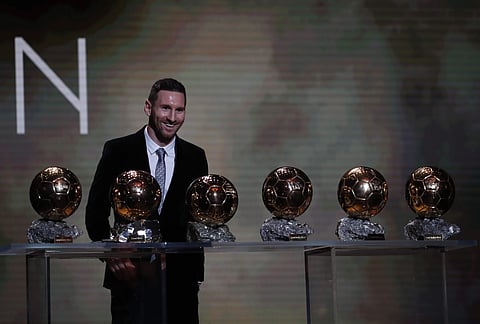Argentine Lionel Messi poses with his six golden balls during the Ballon d'Or award ceremony in Paris. (Photo | AP)
