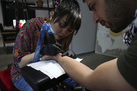 Image of a tattoo artist used for representational purposes only. 