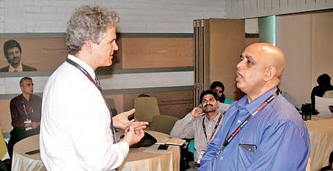 Erik Azulay, Department of Defence (left) speaks to a participant at Nexus  Startup Hub and Defence Startups Workshop at T-Hub in Hyderabad | Sathya keerthi