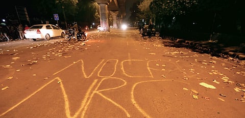 The scene of protest by Jamia students against the Citizenship Amendment Act on Sunday, wears a deserted look on Monday evening; (inset) Jamia students in a shirtless protest  | Arun kumar