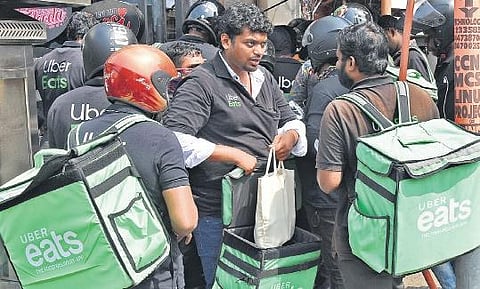 Uber delivery executives at a restaurant in Palayam  B P Deepu