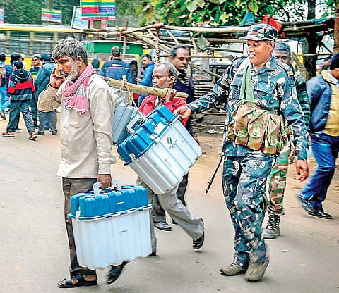 Polling officers carry EVM machines and other materials in Dhanbad. (File Photo)