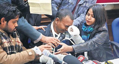 Jamia Millia Islamia student Mohammad Mustafa breaks down while narrating his ordeal to the media, in New Delhi on Tuesday | Shekhar yadav