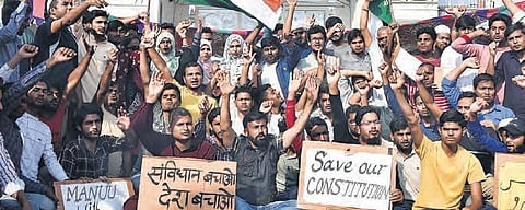 Students display placards in protest against CAA and NRC at MANUU campus in Hyderabad on Tuesday