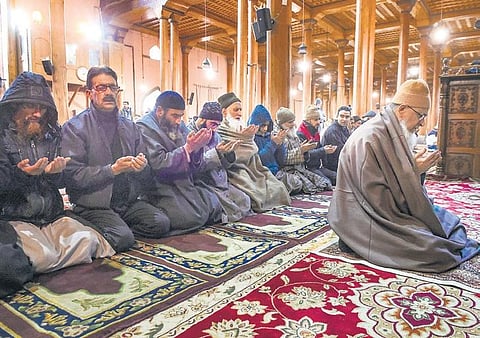 Head priest of the historic Jamia Masjid  leads Zuhr prayers inside the mosque in downtown Srinagar on Wednesday (Photo| PTI)