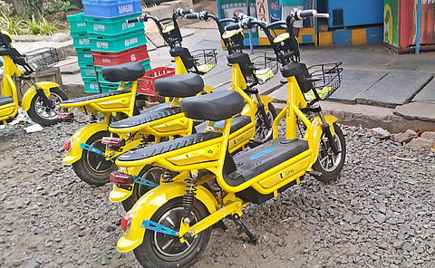 E-bikes introduced by Lona parked on NH 16 in Vijayawada on Sunday| Express